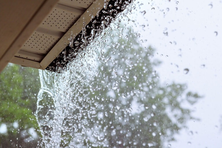 Storm and Natural Disaster Damage Water in Home Overflowing Gutters